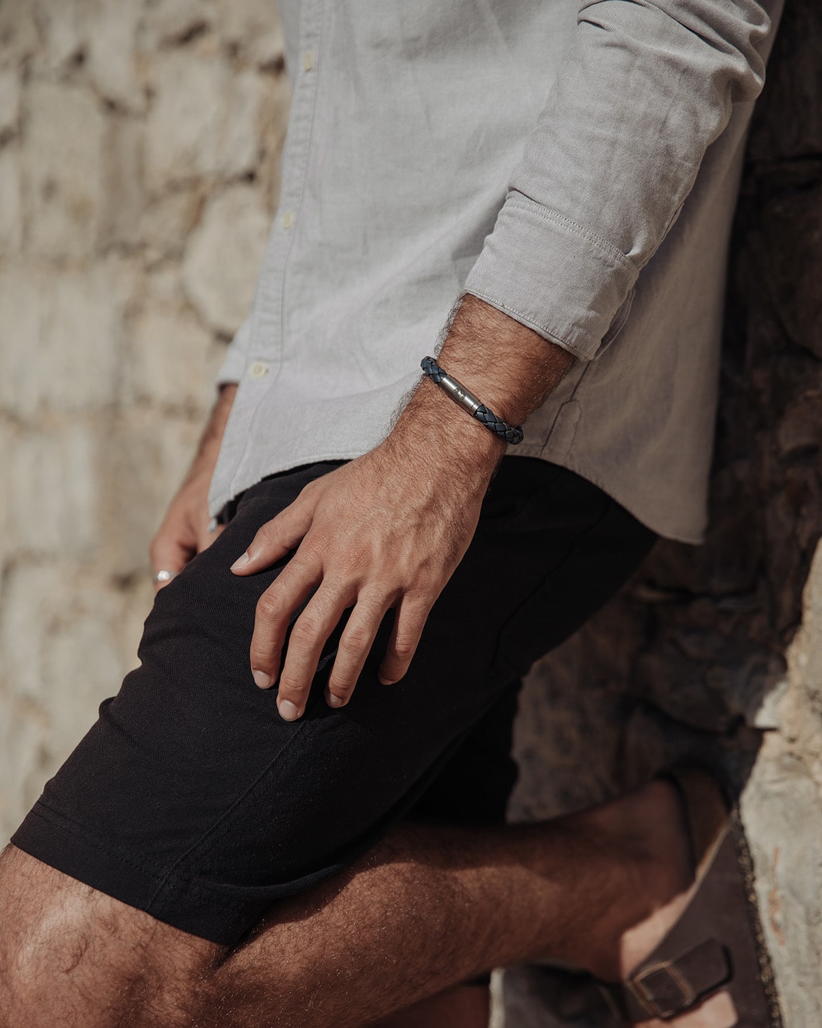 Man wearing summer clothes and leather bracelet