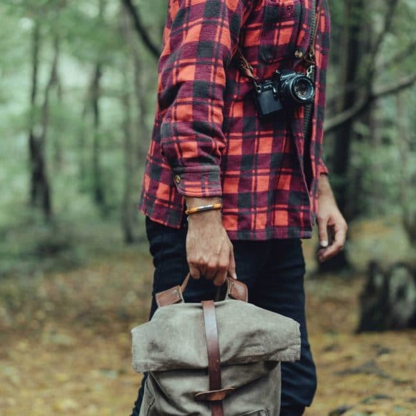 Man wearing orange autumn rope bracelet