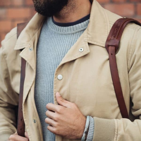 Man wearing sillver rope bracelet outdoors