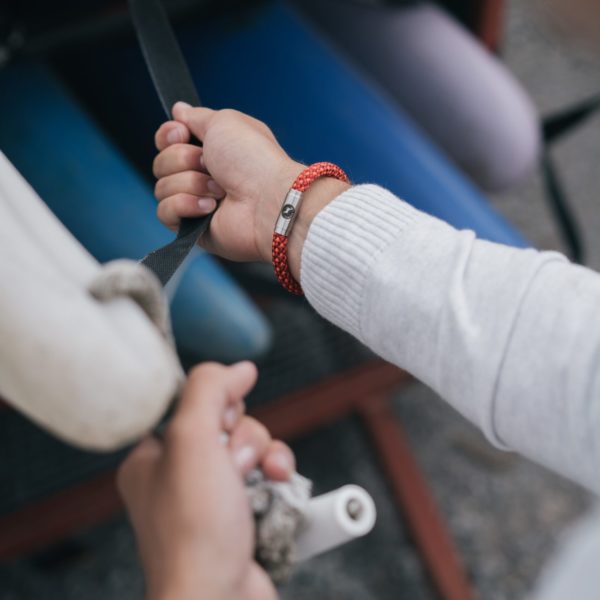 Man wearing saffron bracelet