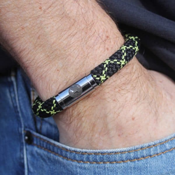 Man wearing black and yellow bracelet